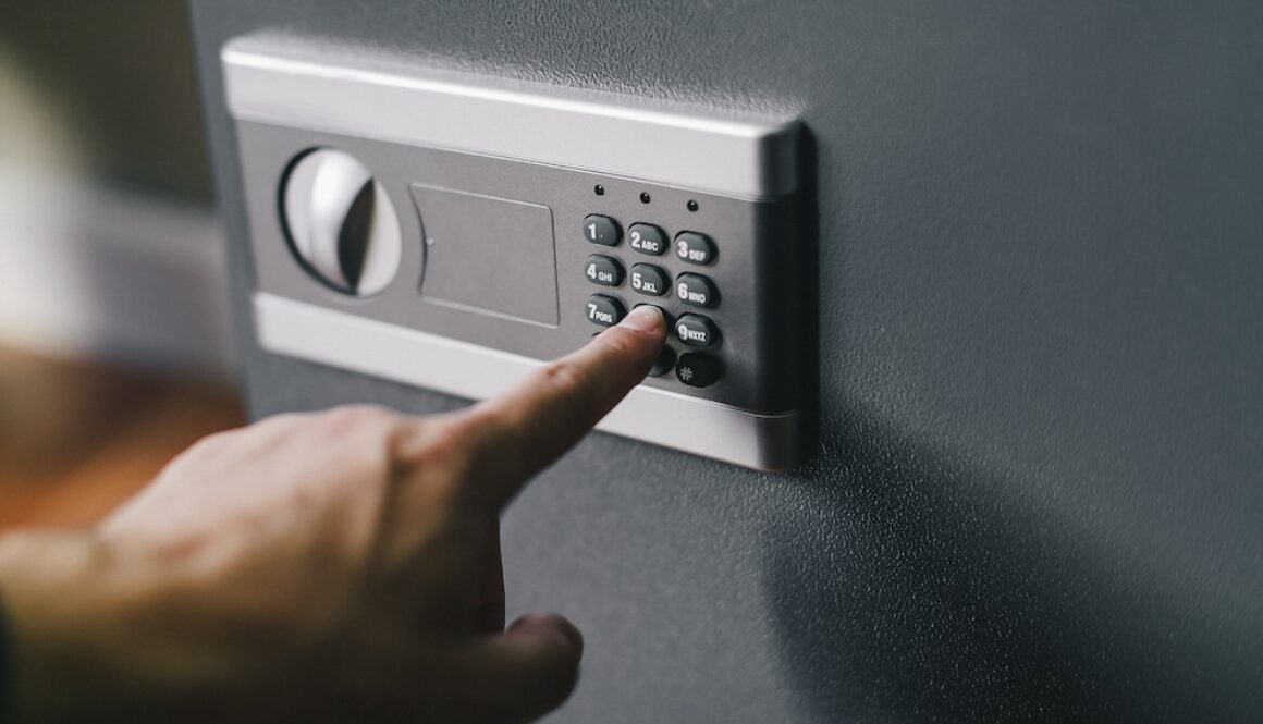 man opens safe, combination lock