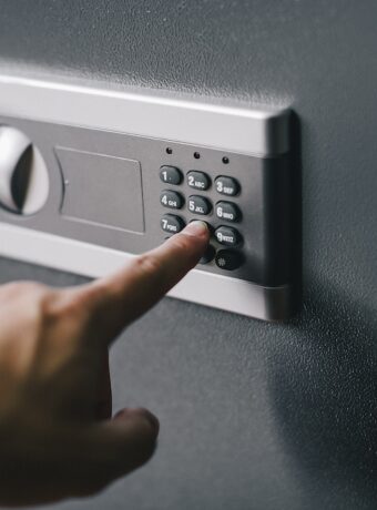 man opens safe, combination lock