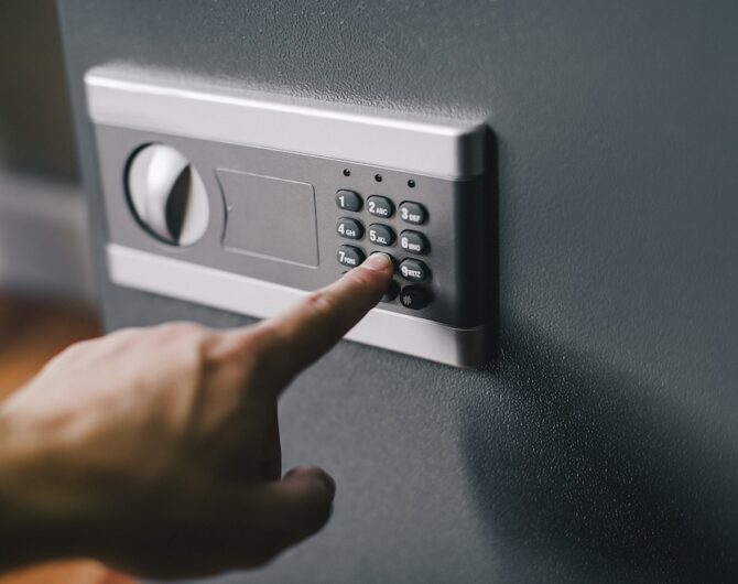 man opens safe, combination lock